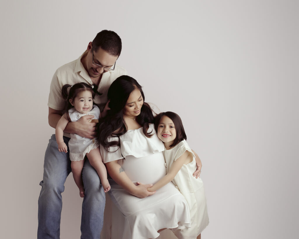 Edmonton Maternity photographer family posed with expectant mother by Kelsie Kelly Photographer
