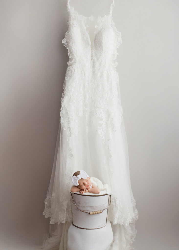 Newborn posed with mothers wedding dress by Kelsie Kelly Photographer | Edmonton newborn portraits