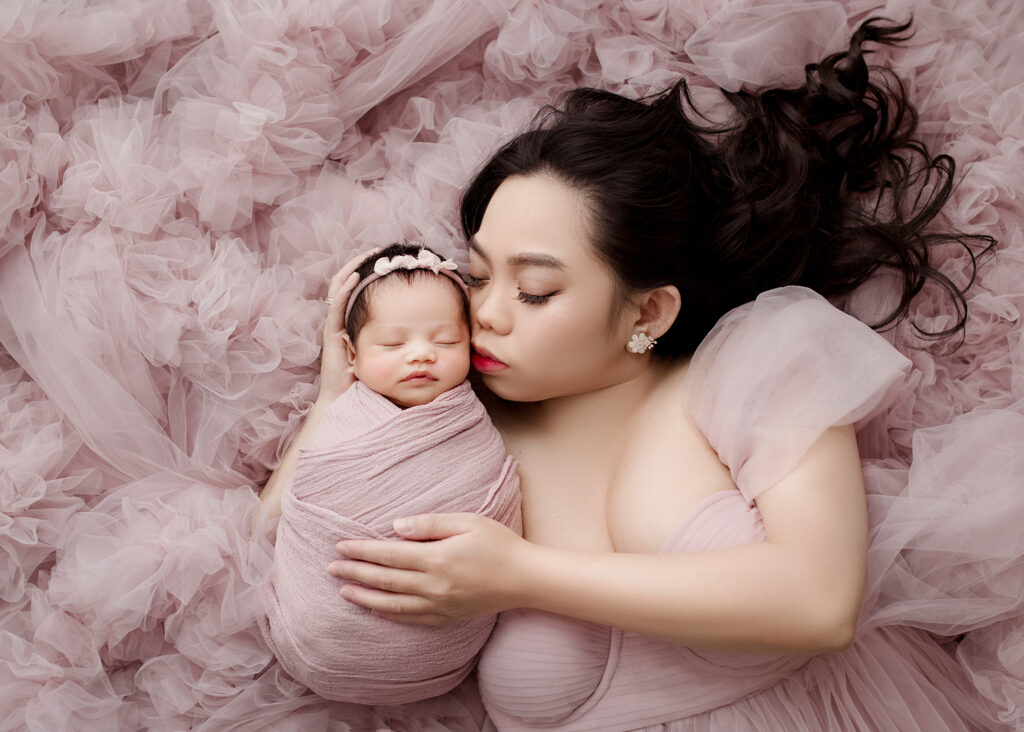 Mama posed with newborn baby by Kelsie Kelly Photographer Edmonton's best newborn photographer